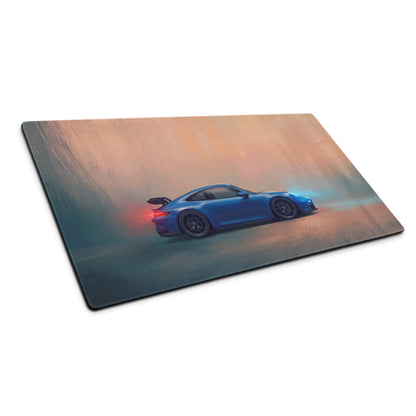 Rectangular desk pad featuring a blue porsche 911 gt3 inspired sports car graphic with stitched edges for gaming use