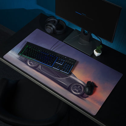 A sleek charcoal McLaren P1 inspired XL gaming mousepad with a silver sports car and glowing orange purple accents