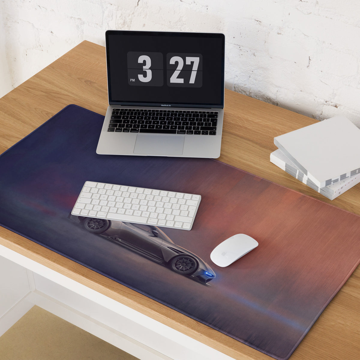 Aston Martin Vulcan inspired charcoal stealth desk pad with stitched edge and a dark blue sports car graphic