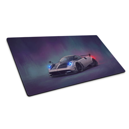 A sleek rectangular silver carbon gaming mousepad featuring a vibrant Pagani Huayra sports car illustration
