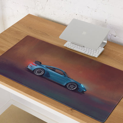 Rectangular desk pad featuring a blue porsche 911 gt3 inspired sports car graphic with ultra glide stitched edge