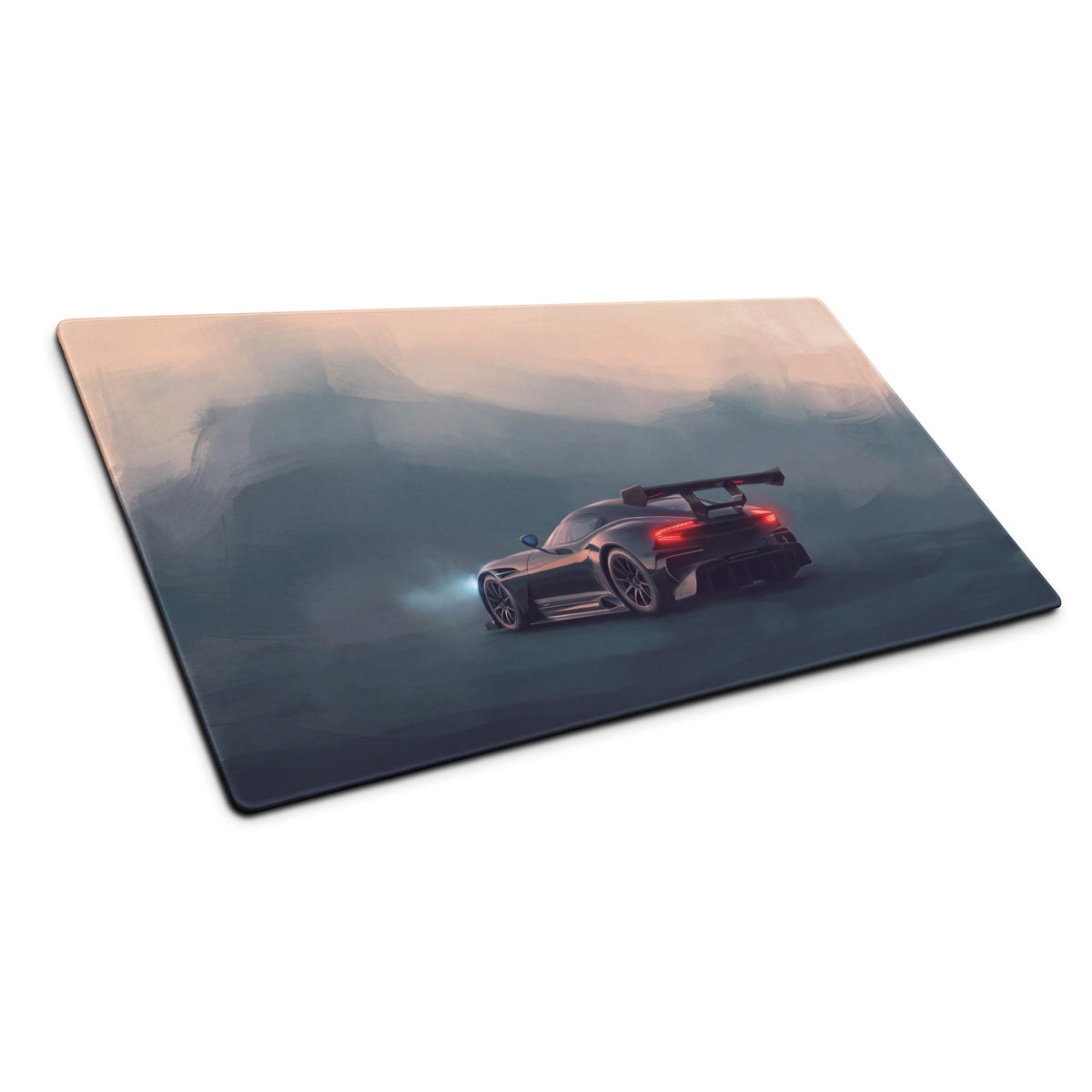 Black racing car graphic on aston martin vulcan inspired onyx track low friction cloth desk mat with misty mountain backdrop