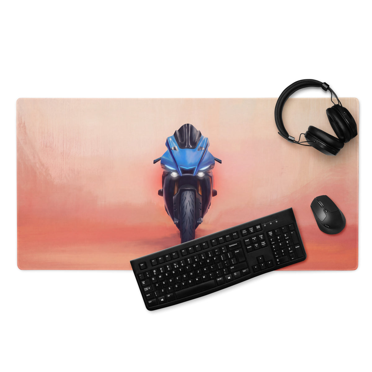 Yamaha R1 inspired extra large blue motorcycle gaming mouse pad on a gradient orange and pink background