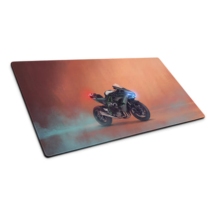 Rectangular gaming mousepad with sleek black Kawasaki Ninja H2 design glowing blue headlights and red taillights on orange teal background