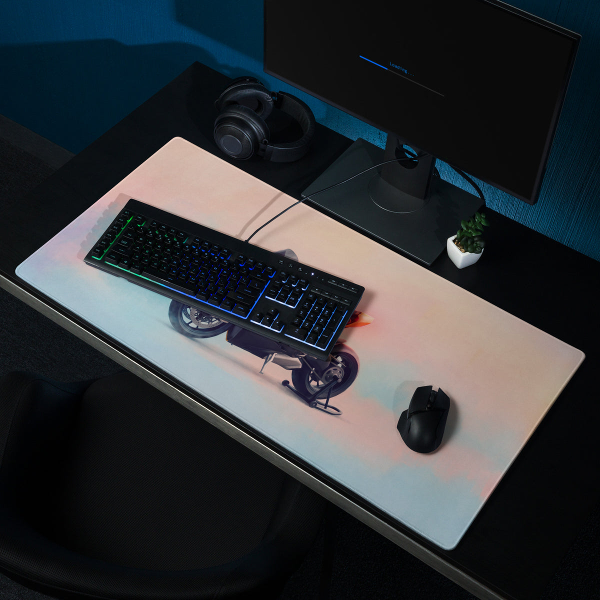 White rectangular gaming desk mat with ducati panigale inspired black and gray motorcycle graphic and orange accents