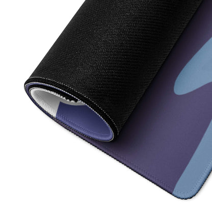 Rolled-up Calm Minimalist Majestic Mountain gaming mouse pad in purple-blue gradient
