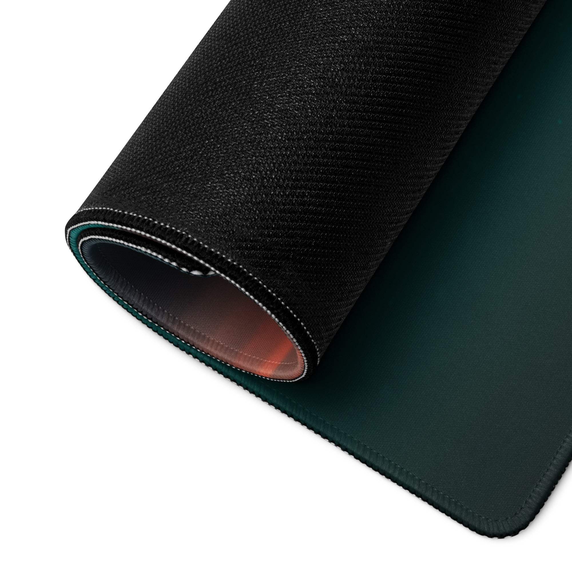 Black textured gaming mousepad with teal ocean sunset edge stitching