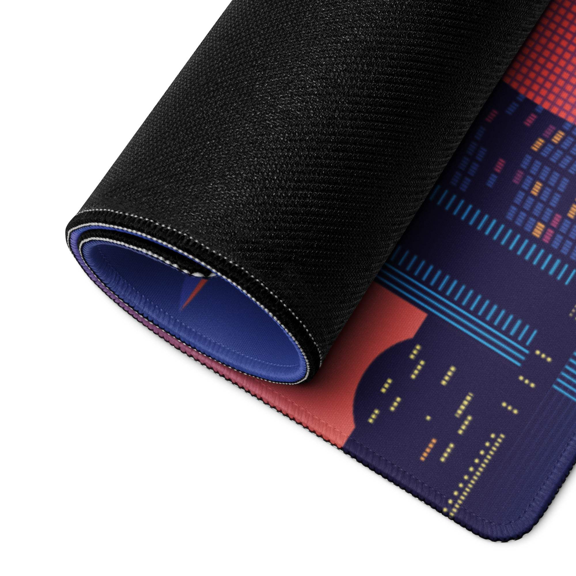 Rolled-up vibrant city skyline gaming mousepad with non-slip base