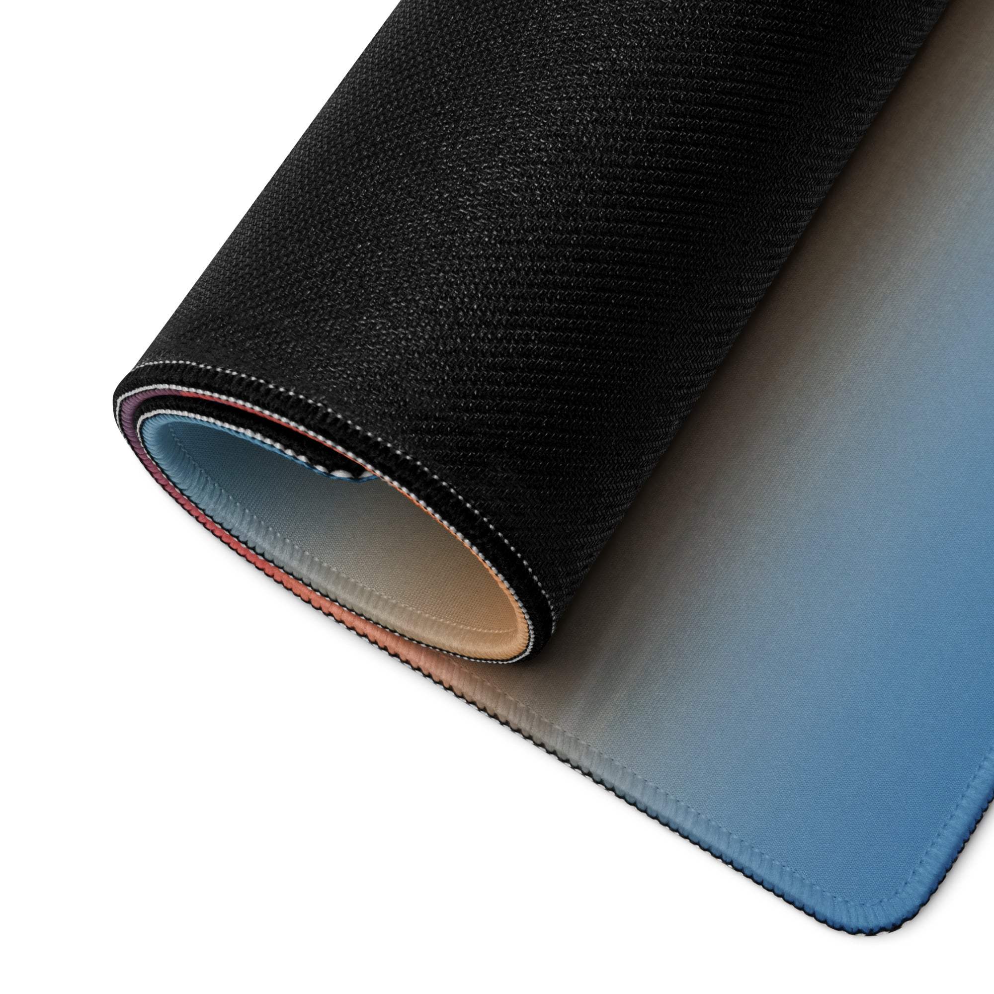 Black textured gaming mousepad back with gradient blue underside and stitched edges