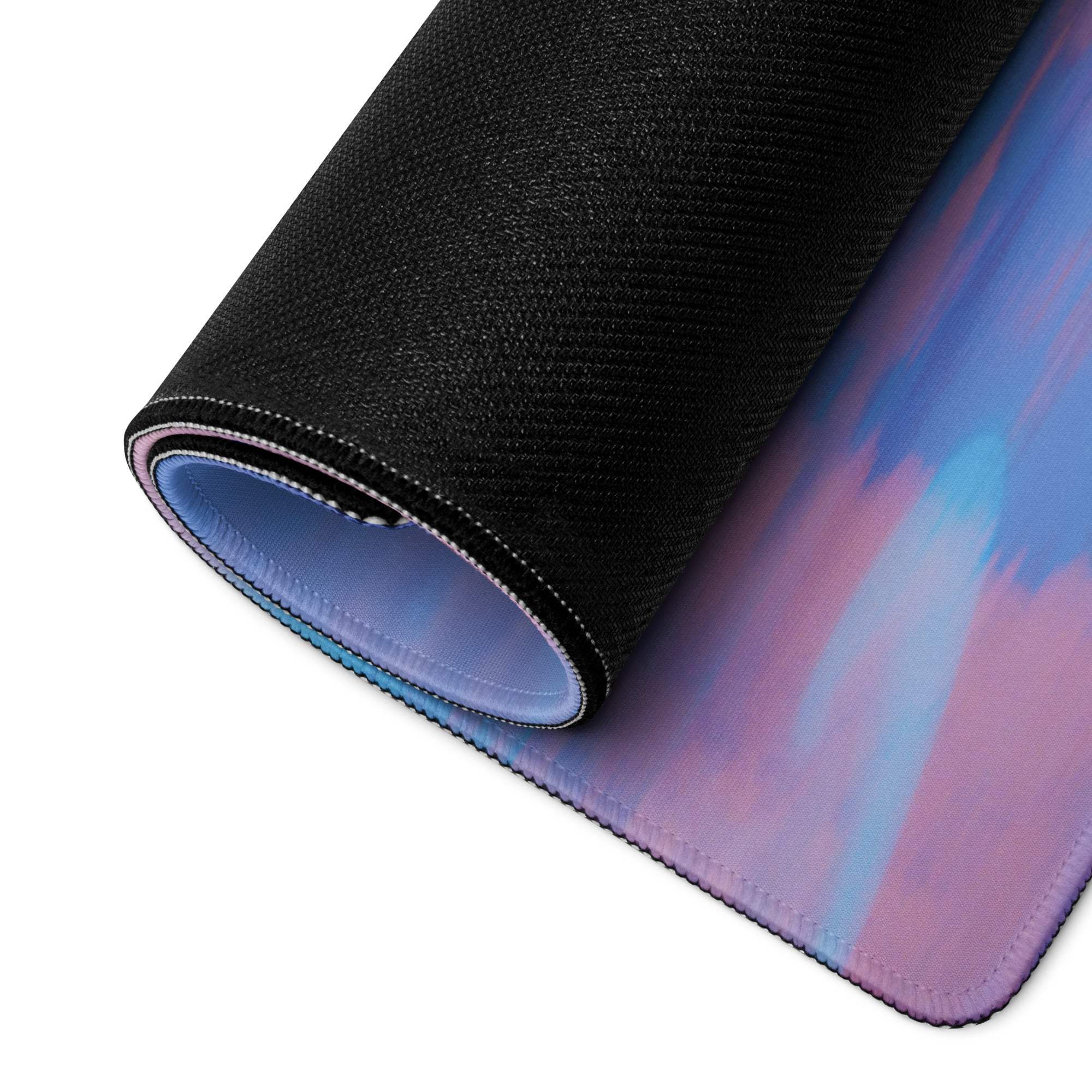 Rolled-up Dreamy Gaming Mouse Pad in pastel ocean sky gradient with non-slip base