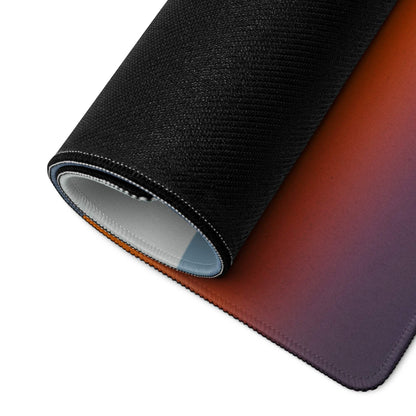 Black textured gaming mousepad with orange-to-purple sunset gradient and stitched edges