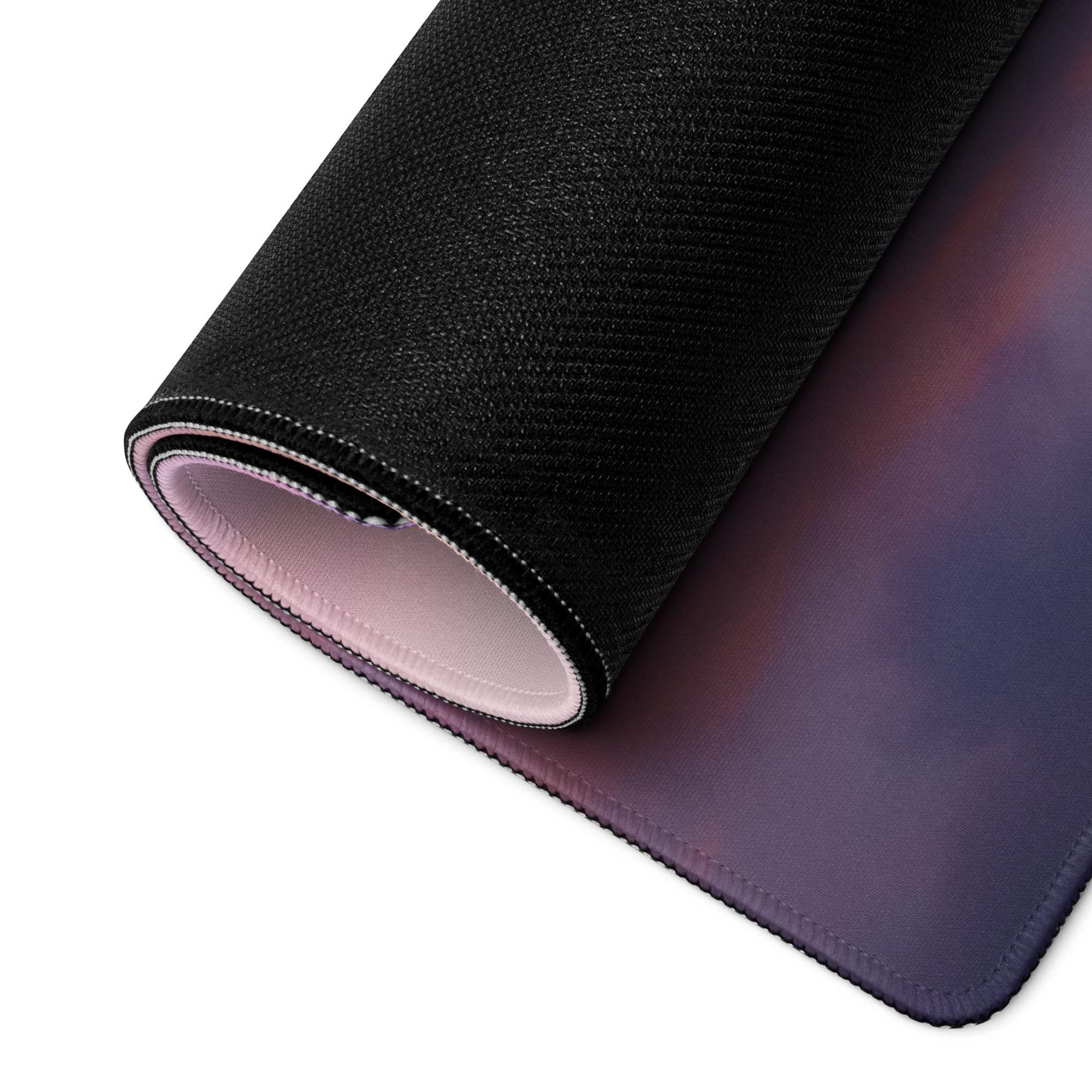 Black textured Dreamy Aurora gaming mousepad rolled to show stitched edge