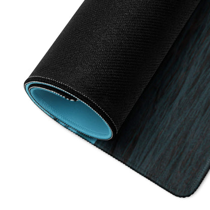 Black textured Calm Ocean Blue gaming mousepad with teal lining, wood-grain surface