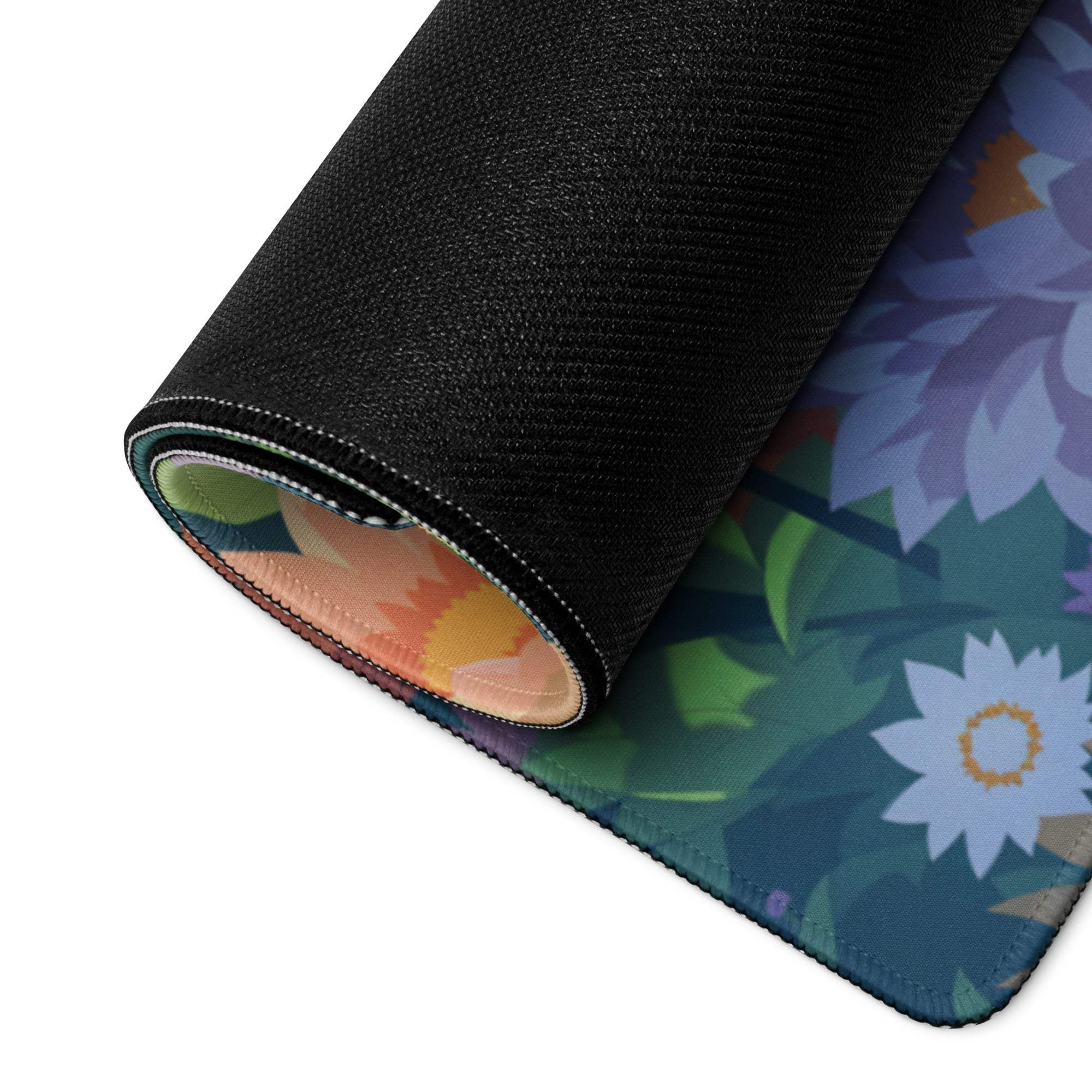 Vibrant floral garden gaming mouse pad rolled up with non-slip backing