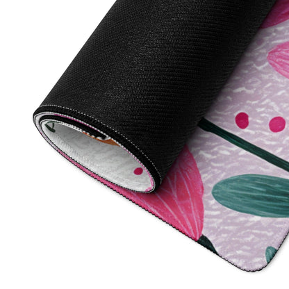 Rolled-up pink green floral rug with black textured backing, large non-slip mouse pad