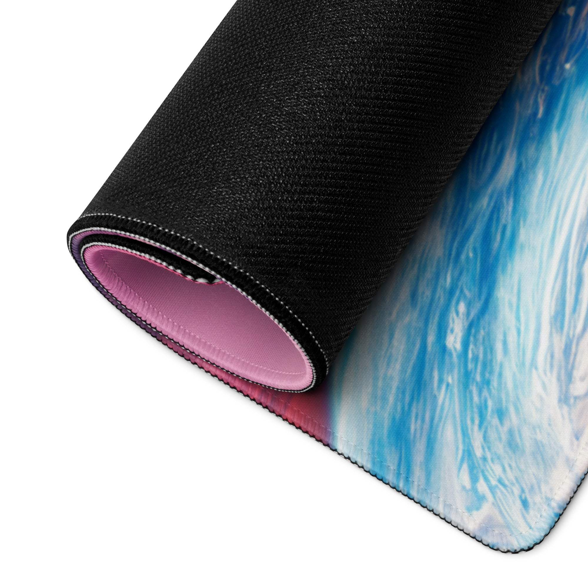 Rolled-up cosmic space gaming mouse pad with ocean wave design