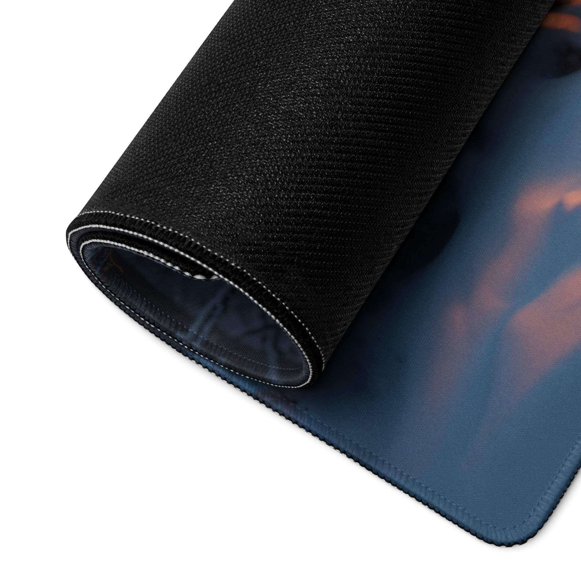Epic Forest Sunset gaming mouse pad with blue skies, orange clouds, stitched edge