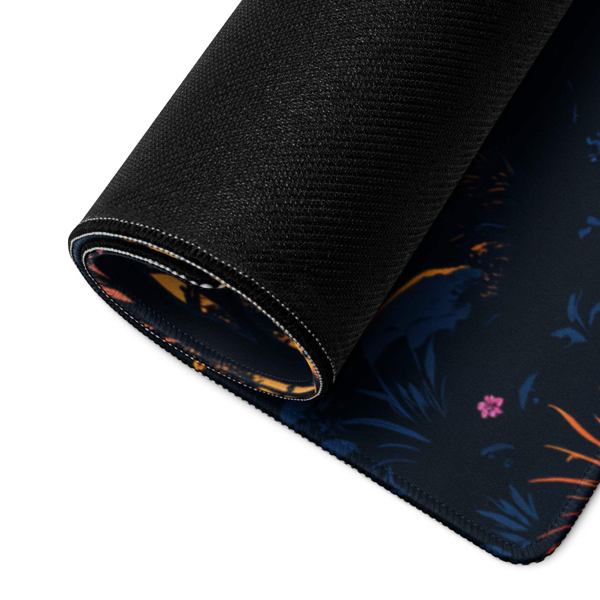 Black rolled gaming mousepad with stylized forest sunset floral pattern