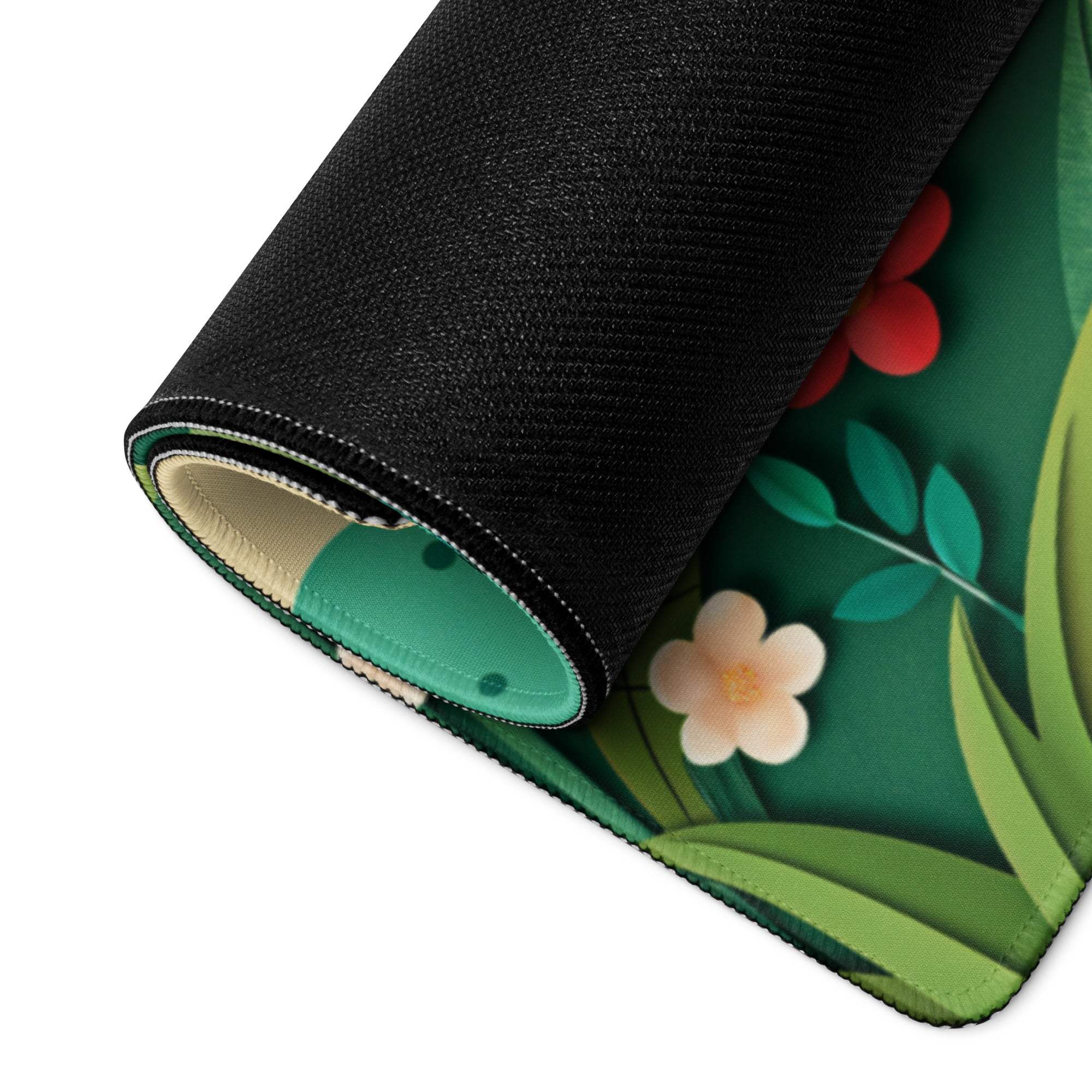 Rolled-up green black floral gaming mouse pad with non-slip stitched edges