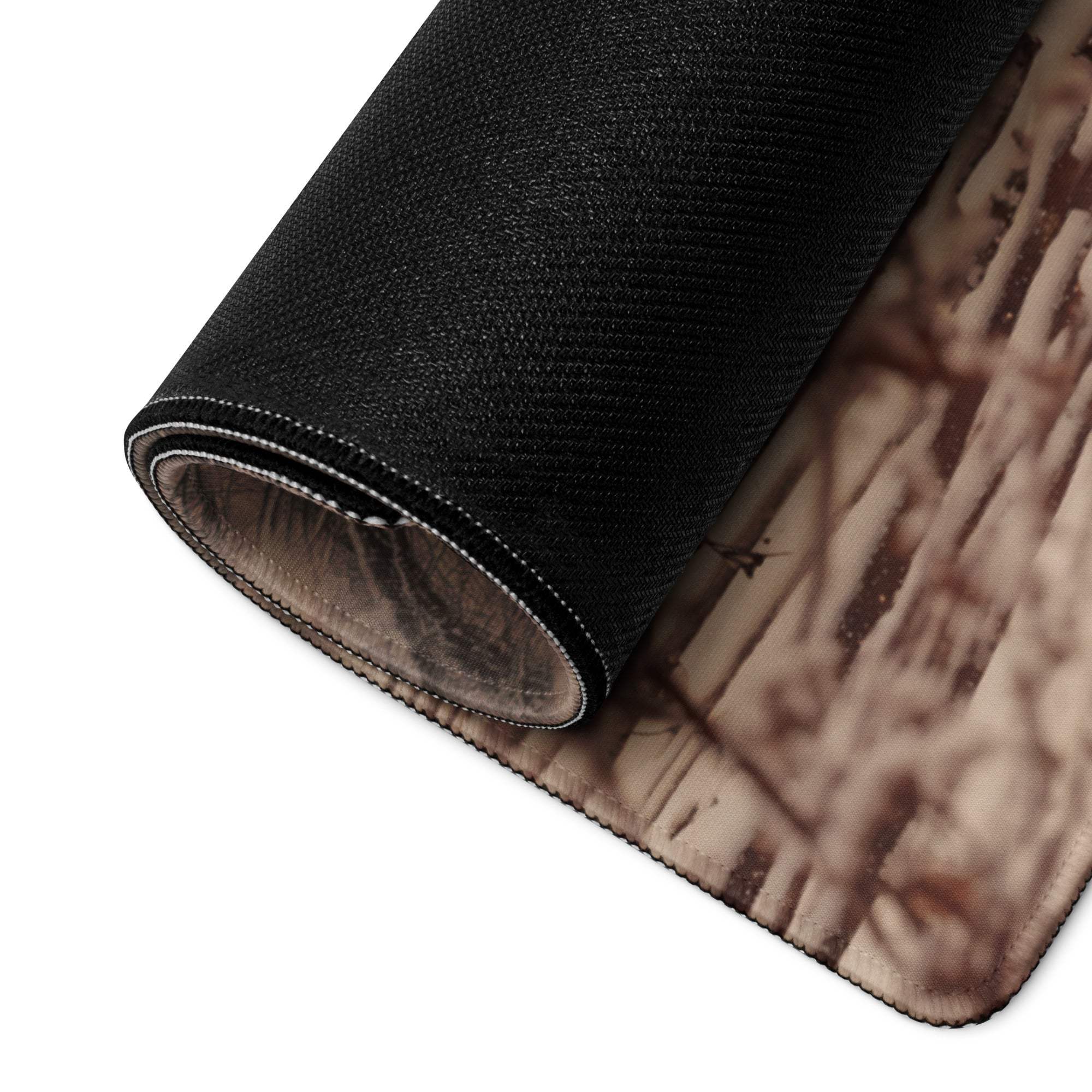 Backside of large rustic winter cabin gaming mouse pad with black camo non-slip base