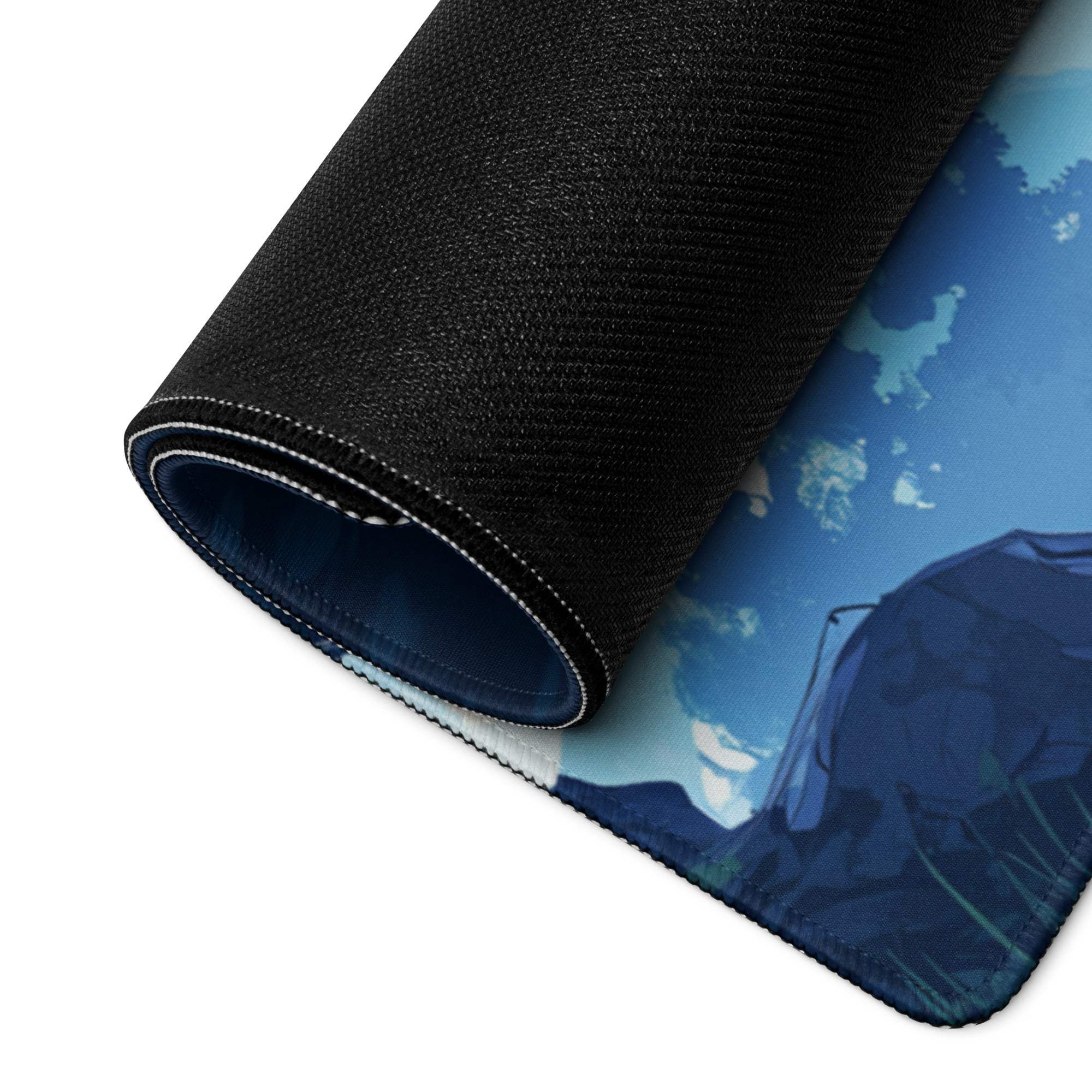 Blue anime landscape waterfall gaming mouse pad with textured black stitched edge