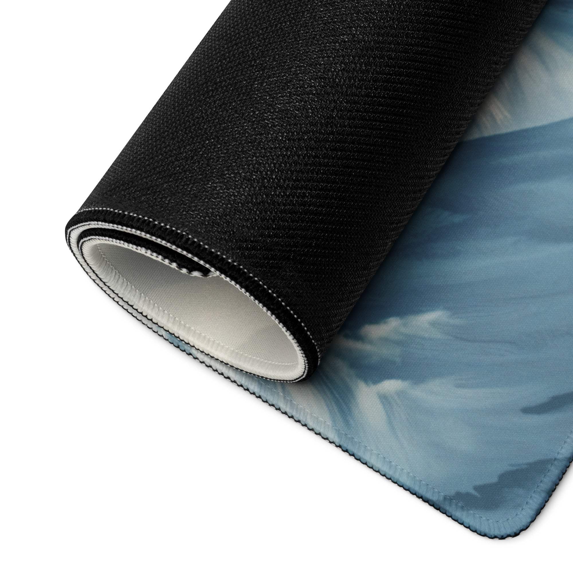 Epic Dragon Landscape Ice Blue Night large gaming mouse pad with black textured back and blue sky clouds