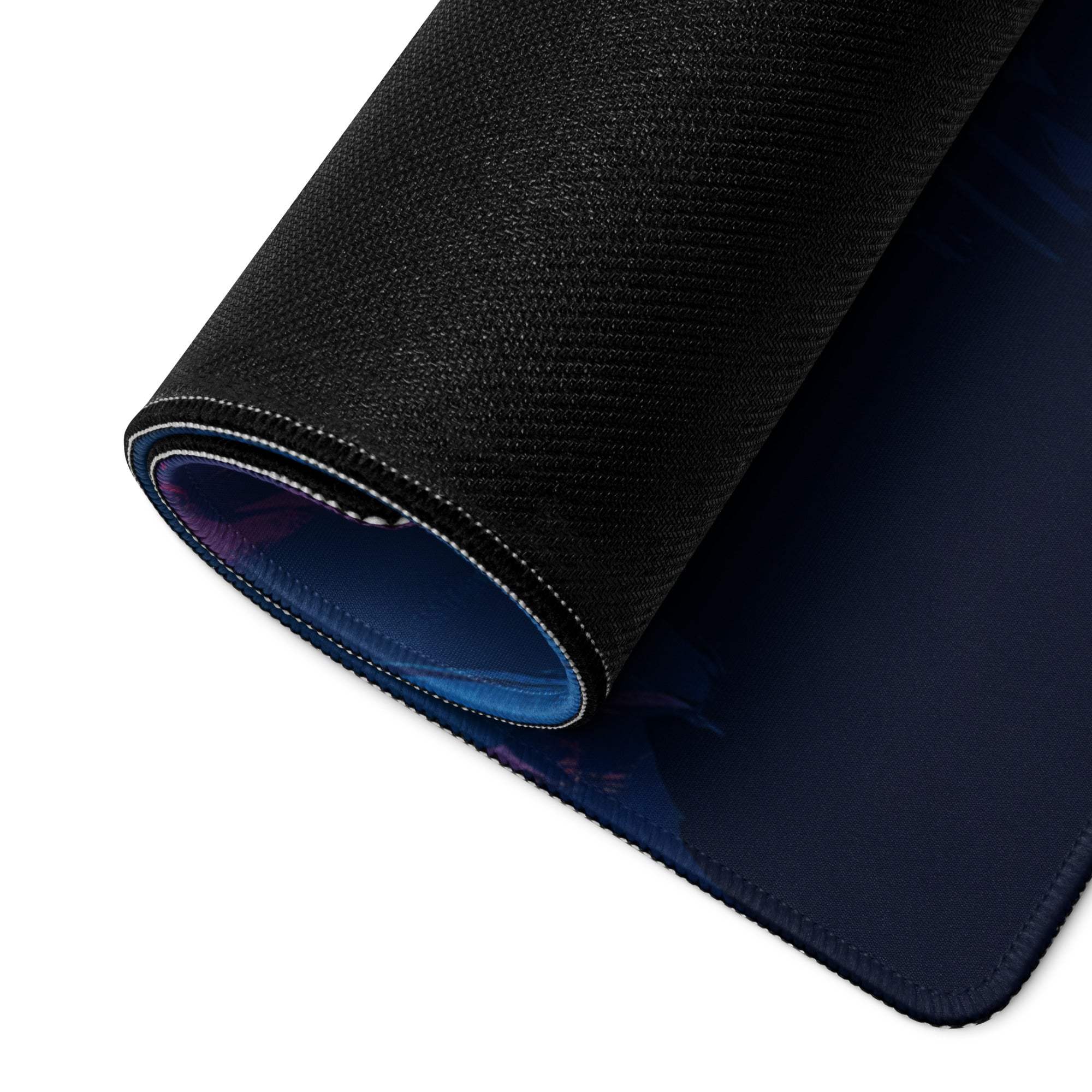 Back of Vibrant Night Sky Rocket Launch gaming mouse pad with black textured top and navy underside