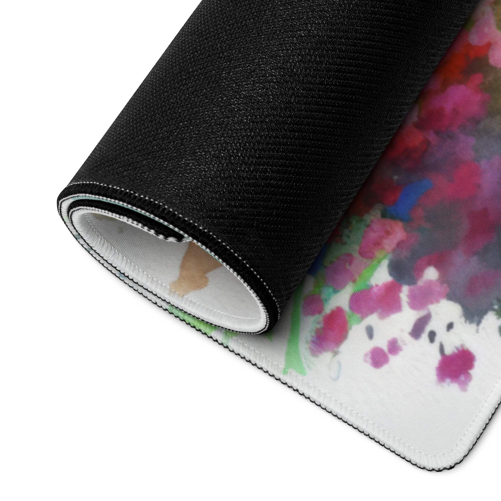 Rolled-up Vibrant Watercolor Cottage Garden gaming mouse pad with non-slip black back