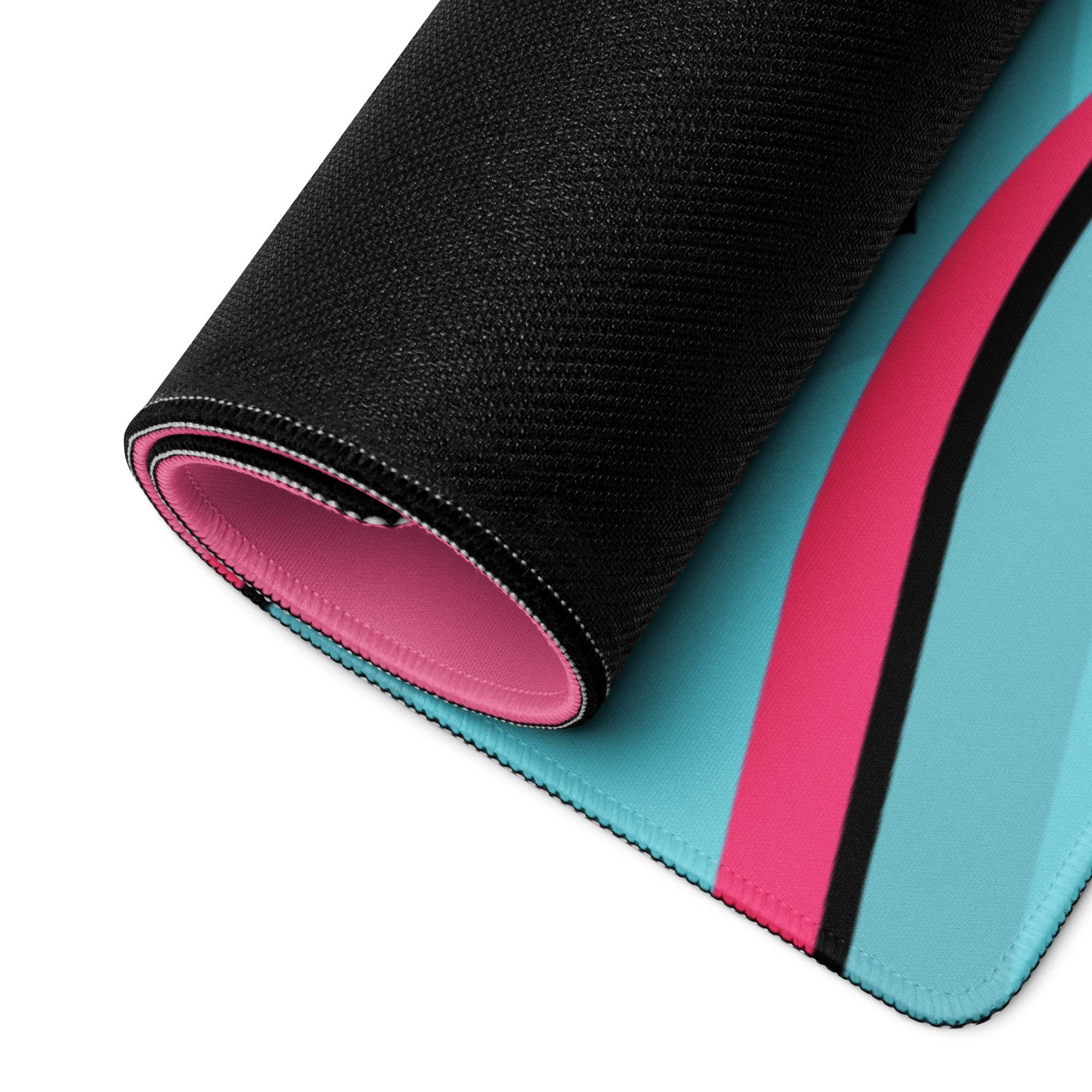 Rolled-up Whimsical Cartoon Landscape gaming mouse pad in pink and turquoise