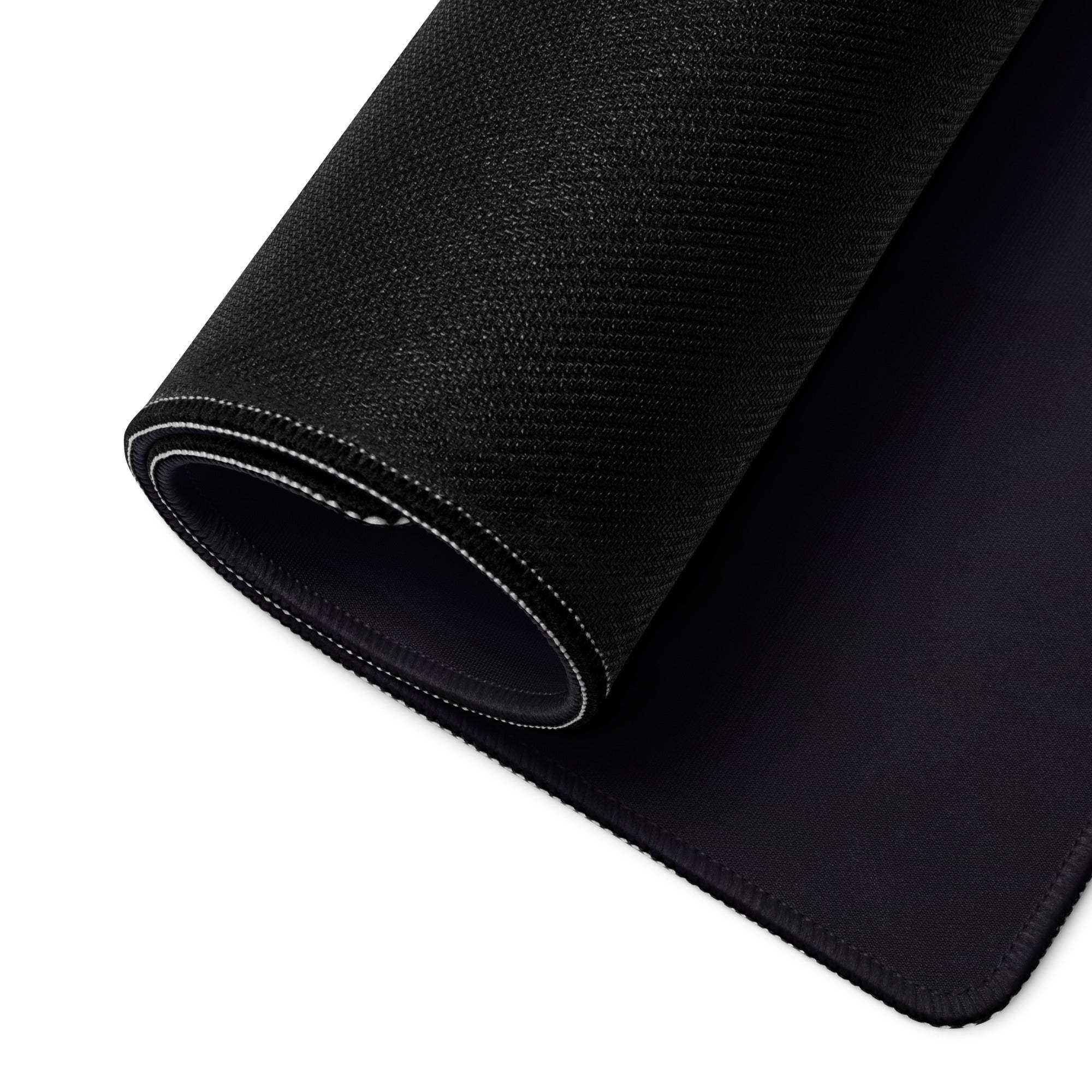 Black textured back of Blue Fantasy Landscape gaming mouse pad with stitched edges