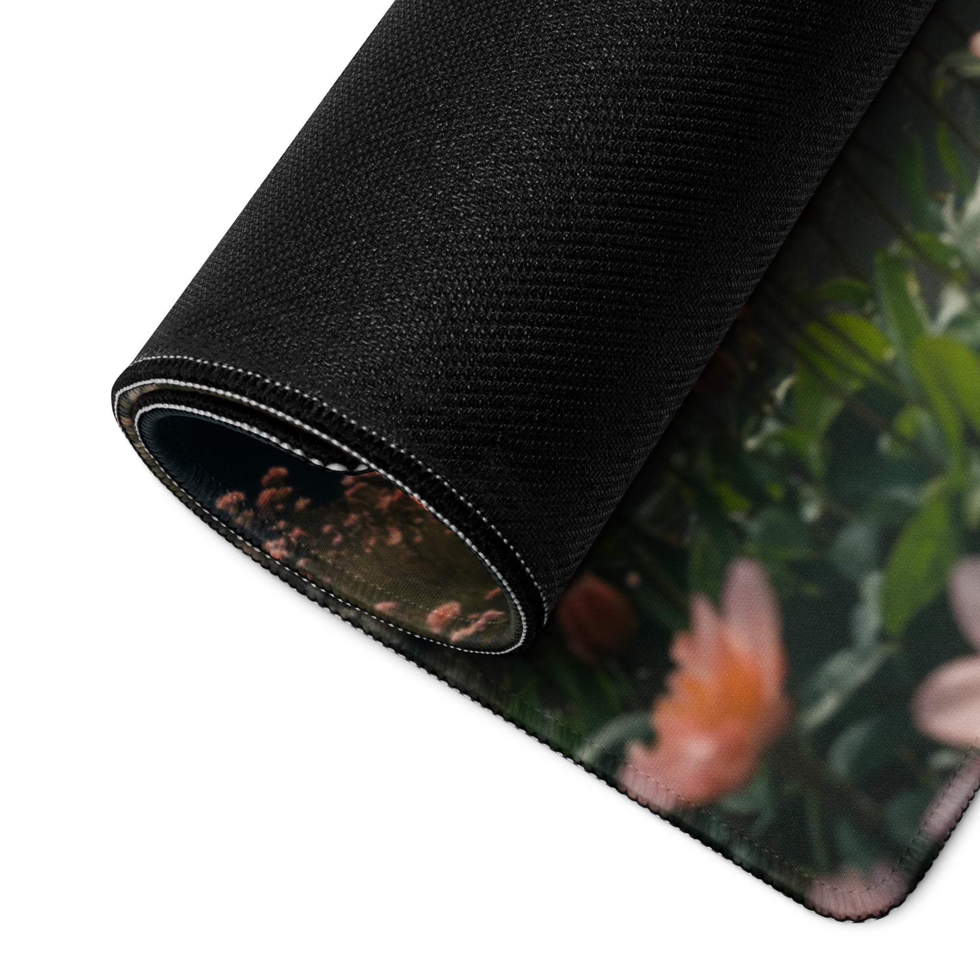 Black floral large gaming mousepad with stitched edges, non-slip backing