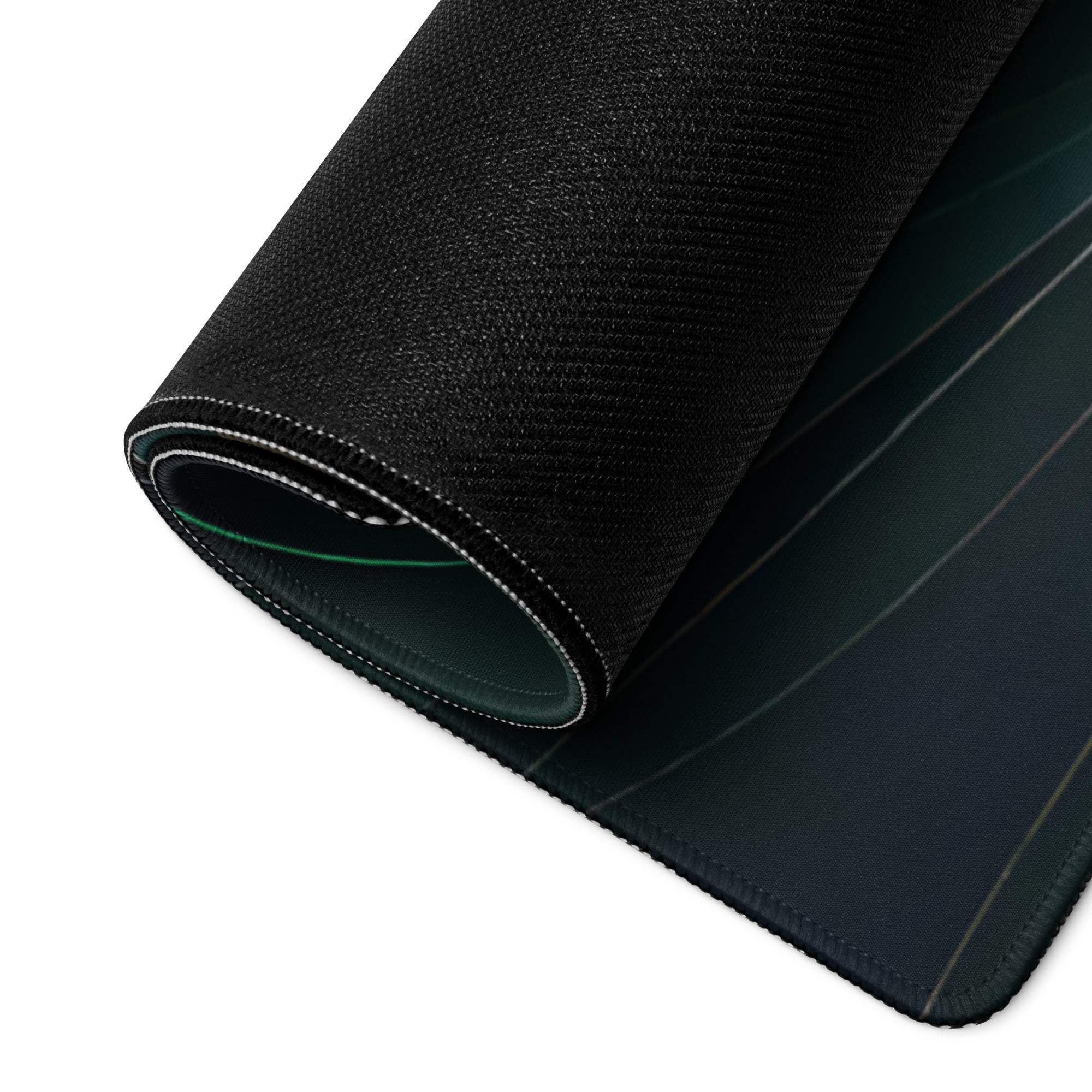 Black textured gaming mousepad with stitched edges, green accent, ocean wave art