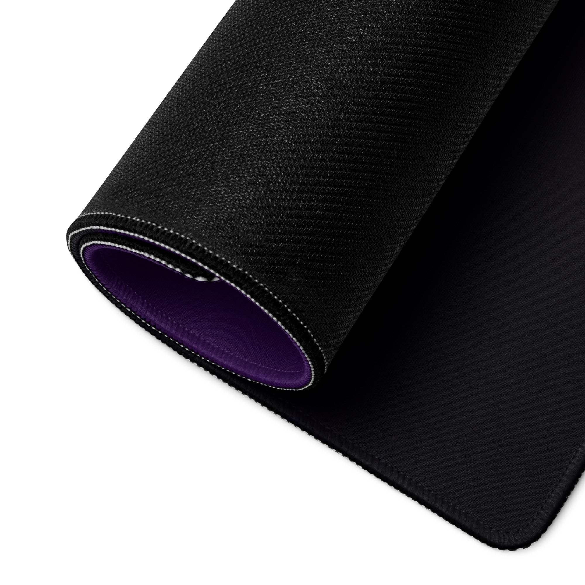 Black textured gaming mousepad with purple lining, white edge stitching