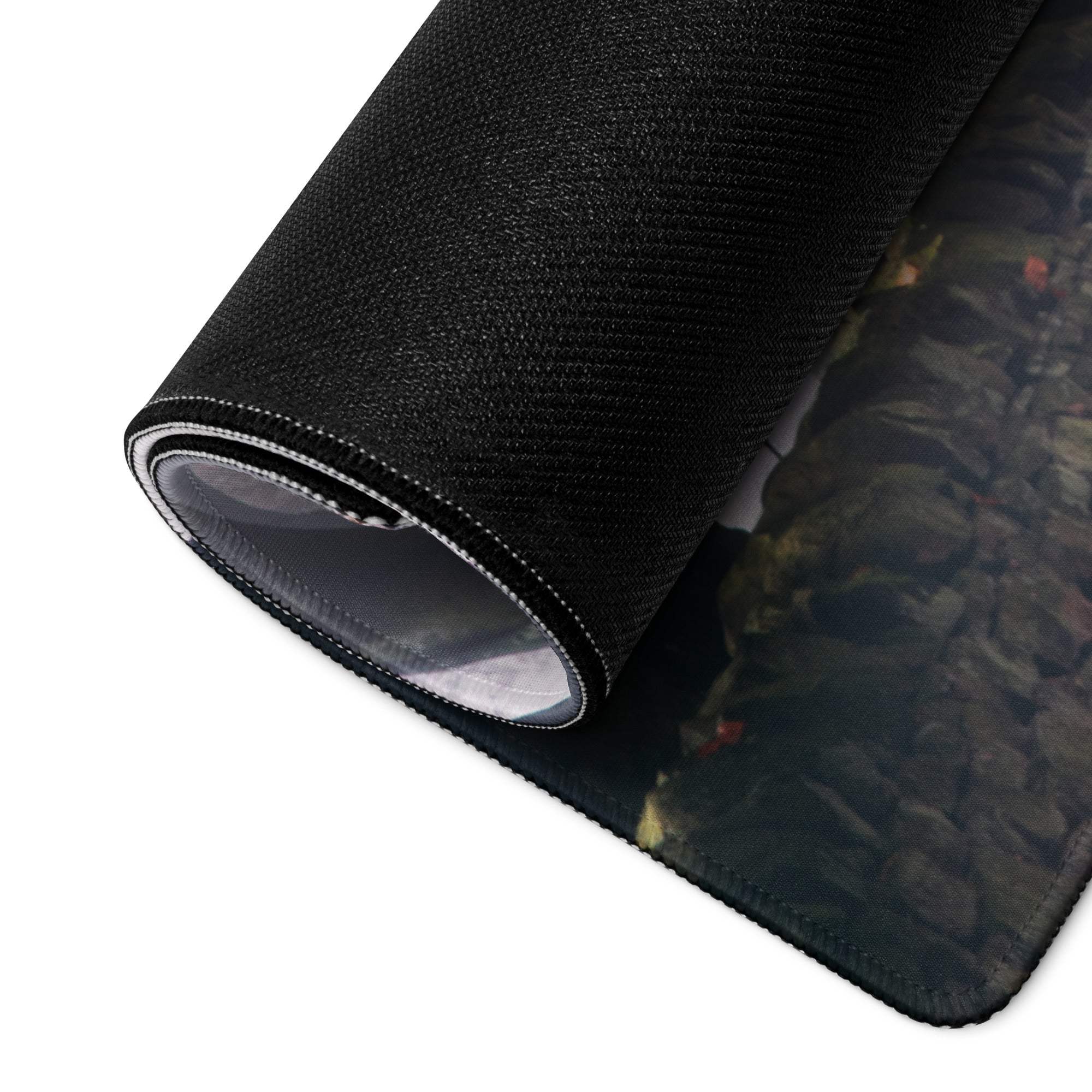 Black textured rocky terrain mousepad with stitched edge, non-slip backing