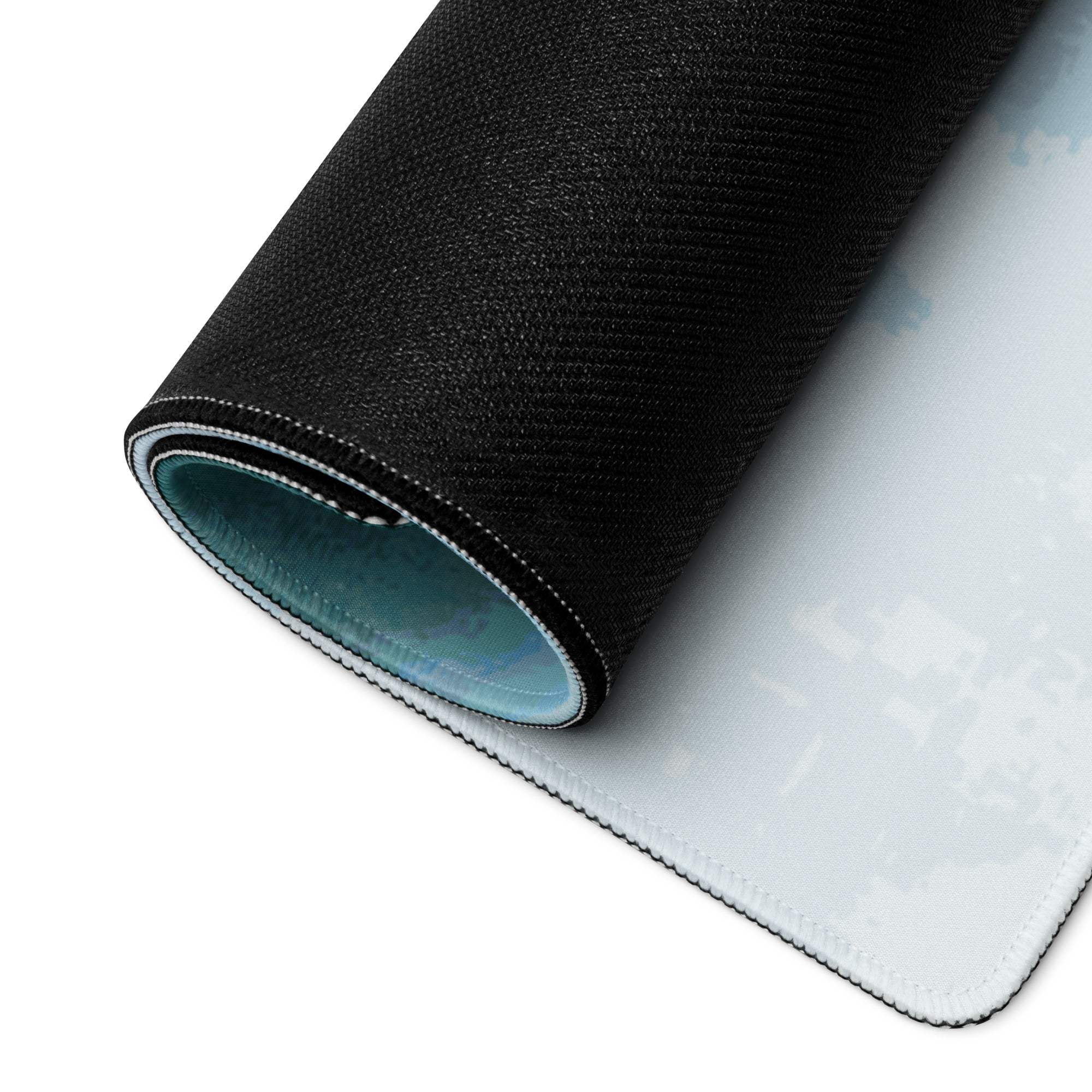 Black textured gaming mousepad with light blue lining, white stitching, non-slip base