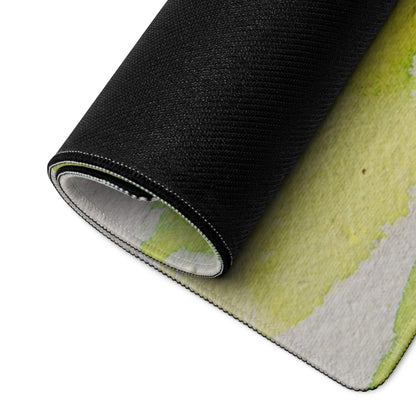 Rolled modern abstract rug in yellow white with black border stitching