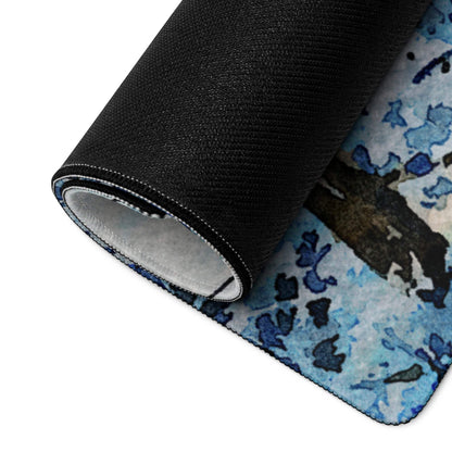 Rolled-up Winter Forest gaming mouse pad with black back and abstract pattern