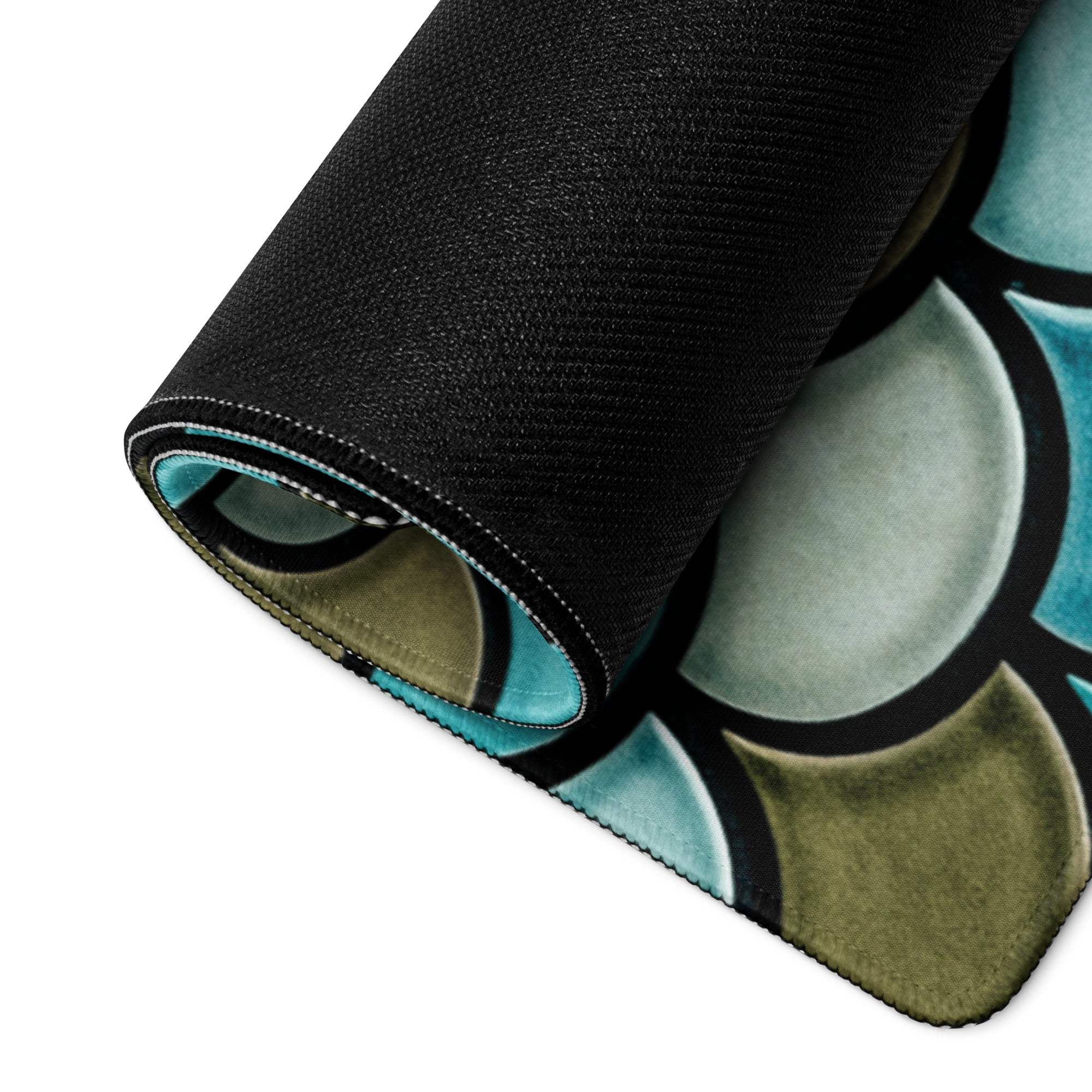 Rolled-up teal mermaid scale gaming mouse pad with non-slip base