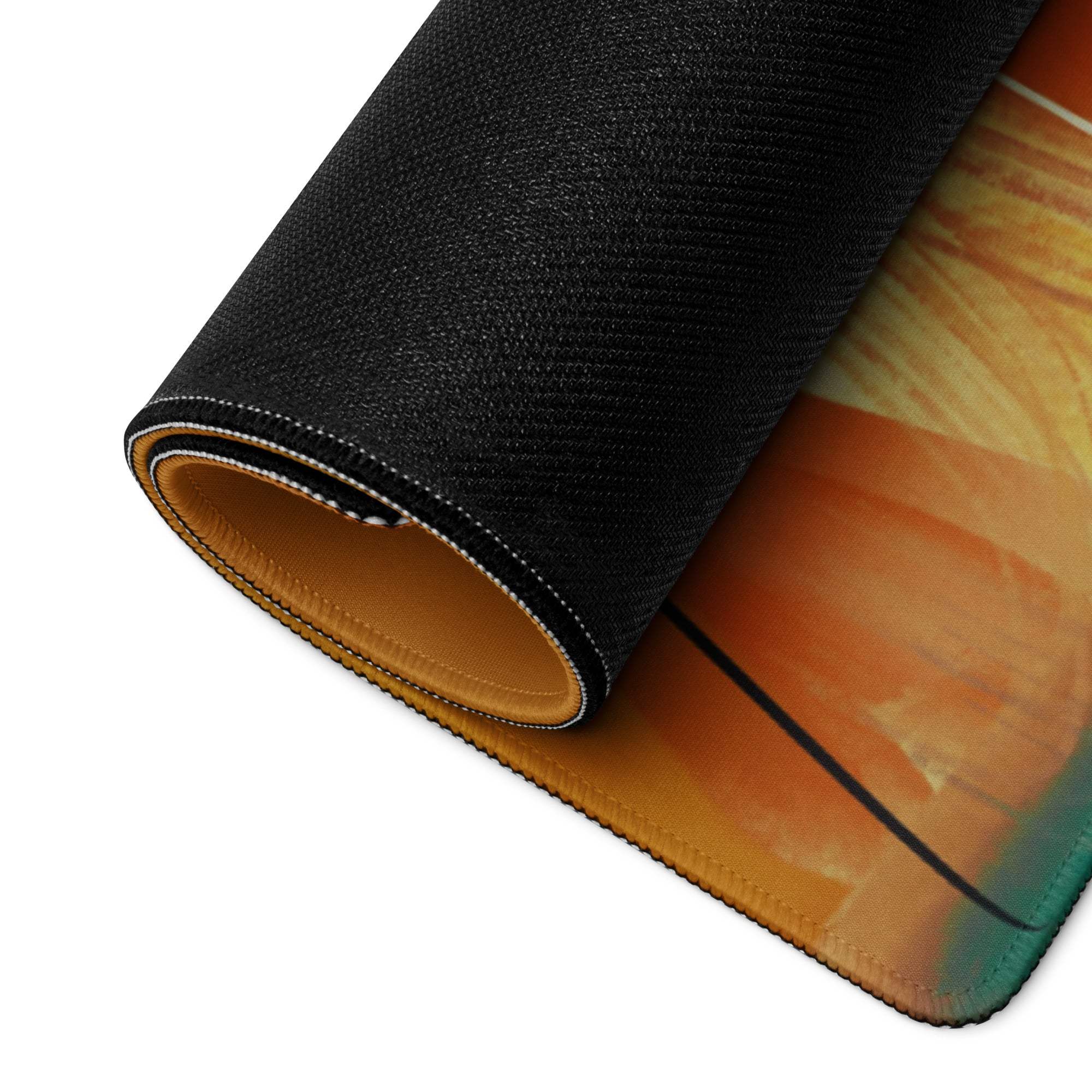 Large abstract art gaming mouse pad with black textured orange teal gradient, stitched edges, non-slip base