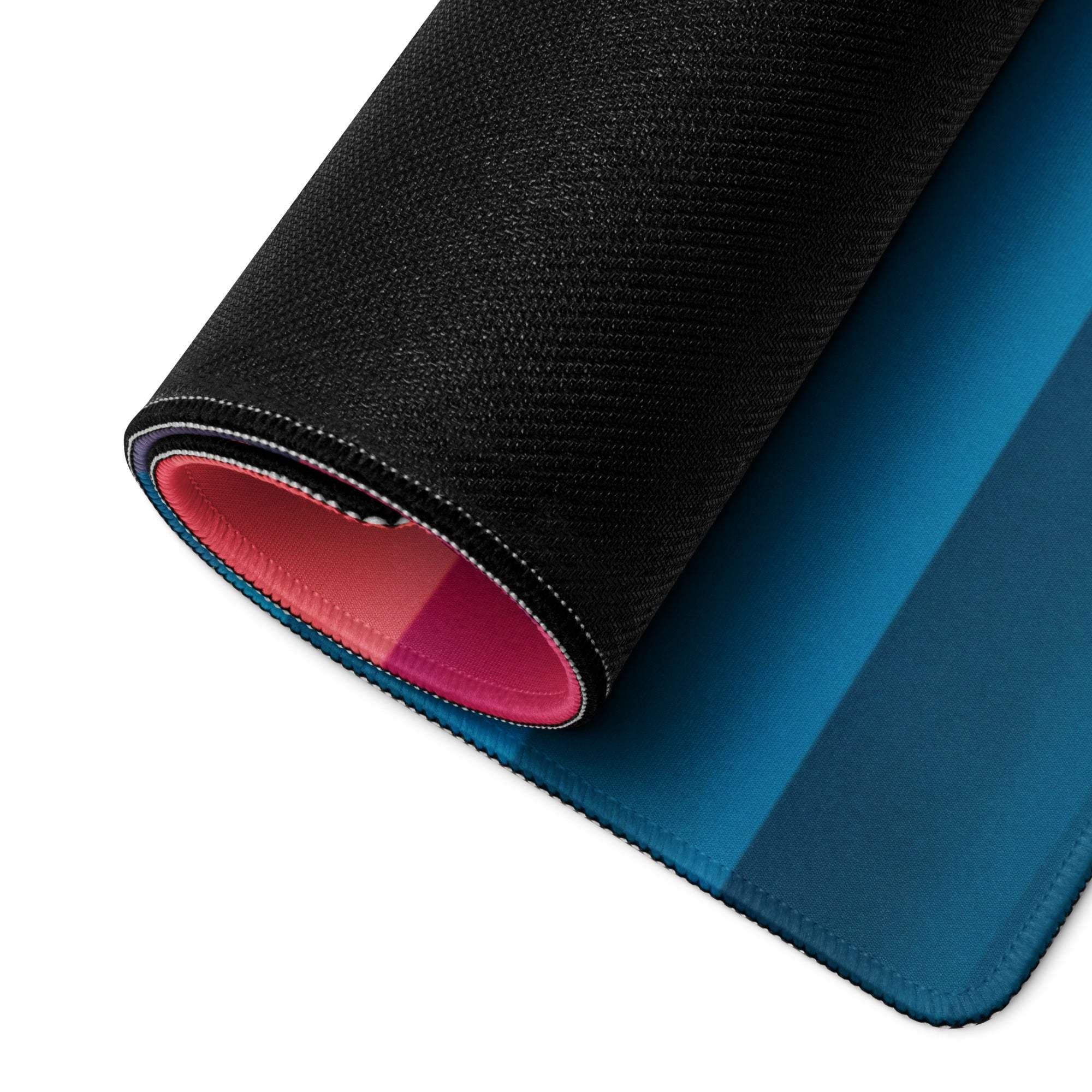 Black textured gaming mousepad with blue gradient, pink lining and stitched edges