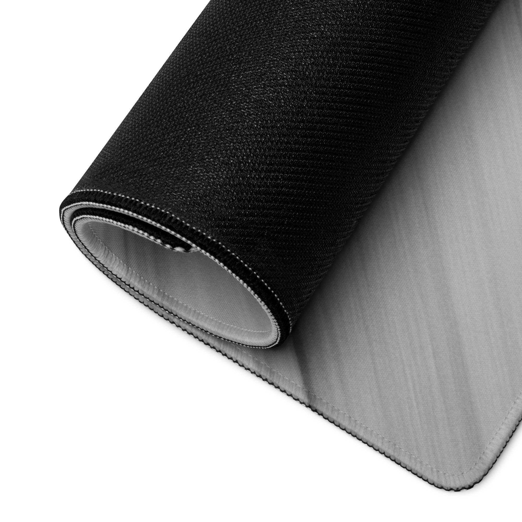 Back of black textured Brushed Aluminum gaming mouse pad with gray lining and stitched edges