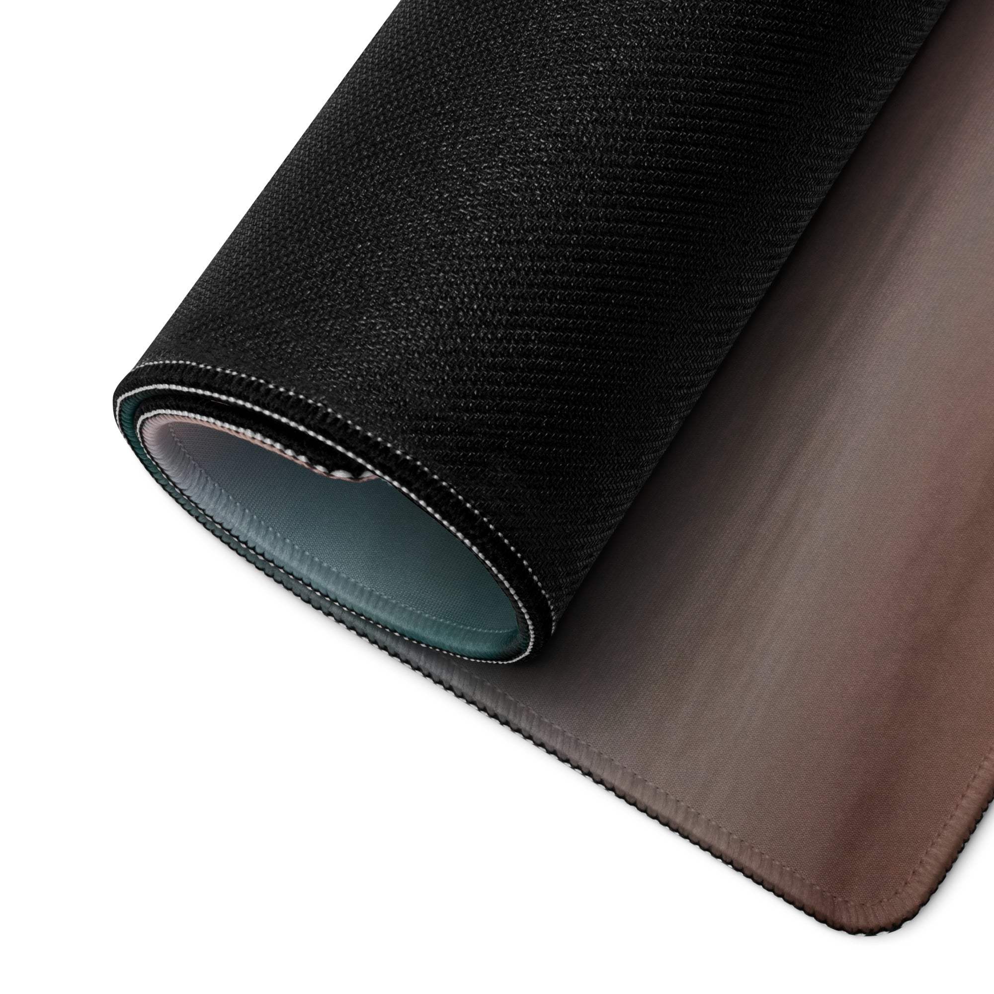 Back of Serene Sunset gaming mouse pad with black textured top, brown leather-like underside and stitched edges