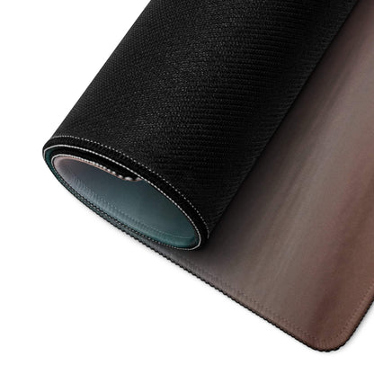 Back of Serene Sunset gaming mouse pad with black textured top, brown leather-like underside and stitched edges