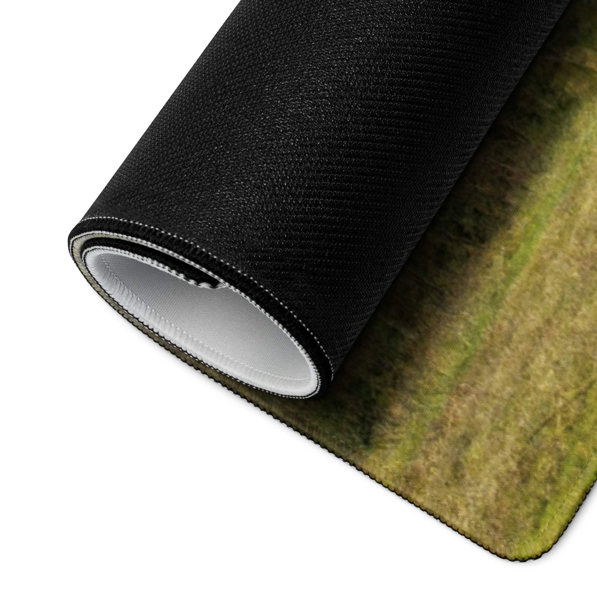 Black textured grassy mousepad rolled to show white lining, large non-slip gaming pad
