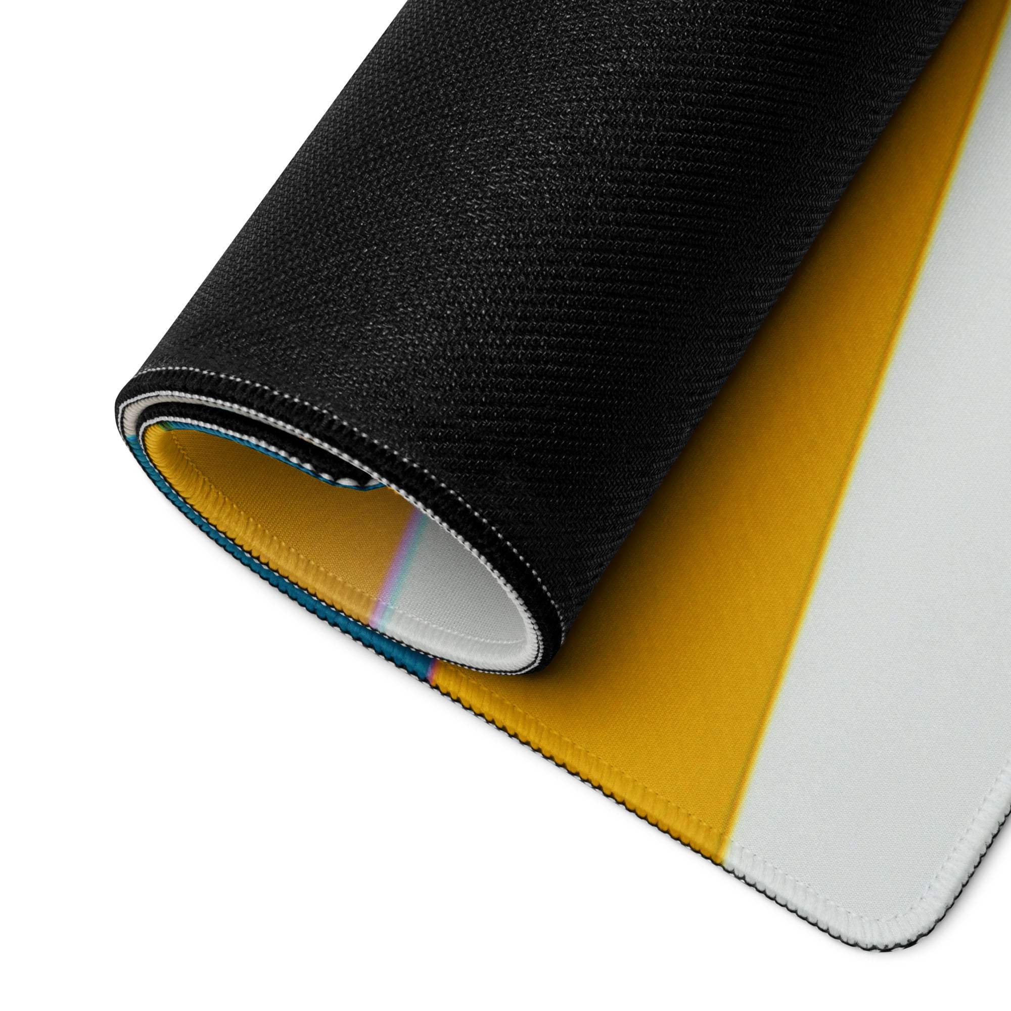 Underside of large black yellow geometric gaming mouse pad with stitched edges