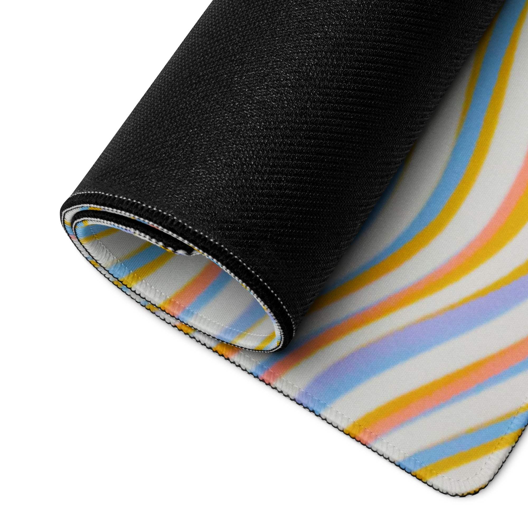 Rolled-up vibrant wavy pastel stripe gaming mouse pad with non-slip base