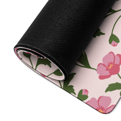 Floral pink green gaming mouse pad rolled up with black non-slip textured back