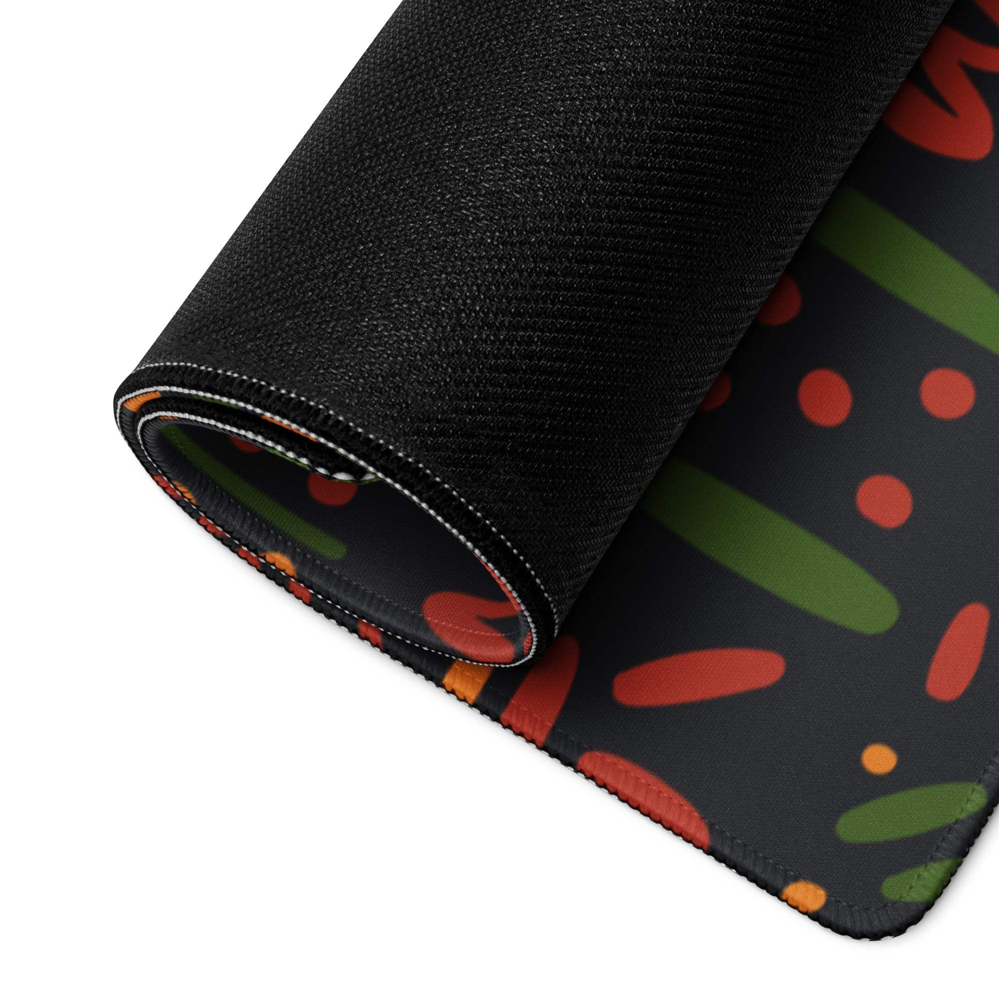 Black gaming mouse pad with vibrant red green orange pattern non-slip backing