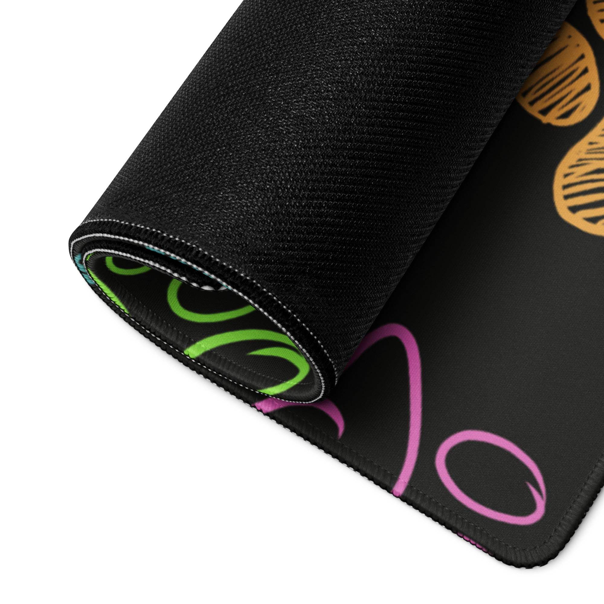 Black gaming mousepad with neon green pink swirls and paw print texture