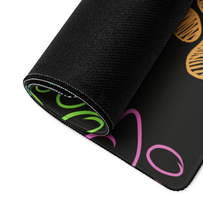 Black gaming mousepad with neon green pink swirls and paw print texture